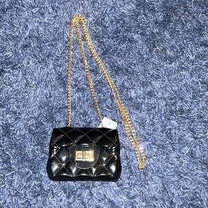Patent leather jelly purse with gold tone chain. Black. NWT